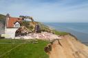 Demolition workers tear down Cliff Farm in Trimingham, Norfolk, which was rendered unsafe to be lived in by the owner after a recent slip left it overhanging the cliff. Picture date: Friday May 10, 2024.