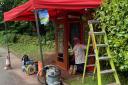 Duracoat workers restoring the vintage phone box at Rosside