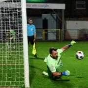 Barrow's Josh Lillis saves a penalty during the EFL Trophy match between Fleetwood Town and Barrow at Highbury Stadium. Pictures: Ian Allington | MI News