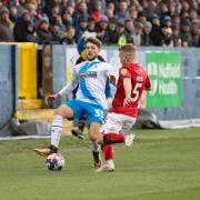 Barrow's Jordan Stevens in action with Swindon Town's Louis Reed during the Sky Bet League 2 match at Holker Street, Barrow-in-Furness on Saturday 17th December. Pictures: Ian Allington | MI News