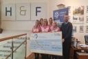 The team at Home and Finance presenting the cheque