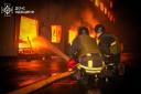 Emergency services personnel work to extinguish a fire following a Russian attack in Odesa (Ukrainian Emergency Service via AP)