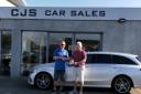 Jeff Coward of the Barrow and District Rugby League being presented with a £250 cheque from Jimmy Salisbury of CJS Cars