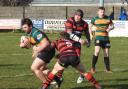 LOST CAUSE: Sam Broadley goes on the charge for Askam, as they try to fight back against Leigh East
