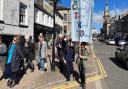 Christians take part in the annual Good Friday Walk of Witness through Kendal town centre in 2023