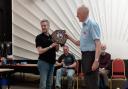 Chris Leviston (left) collects the trophy on behalf of FARS
