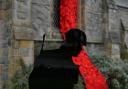 Remembering World War One, 100 years on. A Tommy Soldier silhouette and a weeping window of poppies outside Christ Church Silloth: 5 November 2018..STUART WALKER.