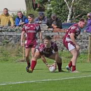Millom held off a strong fightback from their visitors