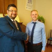 LOOKING BACK: Nick Perie (left) when he took over as mayor in 2019