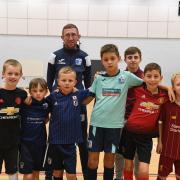 TIGHT-KNIT: Ben, Harris, Joel, Lewis Cjay and Callum with community coach Matty Taylor at Barrow AFC Community Trusts' final futsal session at Furness College