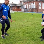 STUCK IN: Year 5 pupils practicing their skills with Barrow Raiders