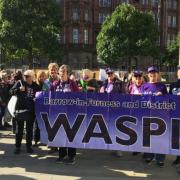 Barrow WASPI campaigners next to suffragette statue in London.