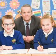 Vickerstown School Headteacher David Holmes with pupils Henry Doughty and Niamh Ottley.