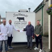 L-R: Andrew Southward, Gavin Southward, Cllr Mike Cumming, Cllr Ben Shirley at Southwards farm shop, Station Yard, Askam in Furness. Cllr Cumming is presenting the Southward brothers with a cheque