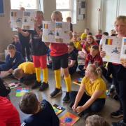 Pupils show off what they have learned about Belgium
