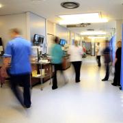 Staff on an NHS hospital ward (PA)