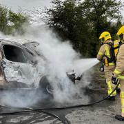 Firefighters tackling a van on fire on Friday