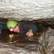 Visitor caving in the Lake District with Go Cave (gocave.com)