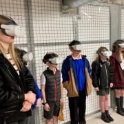 Year Six pupils trying out the VR headsets