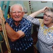 Ian Taylor ringing a church bell along with his wife Margaret