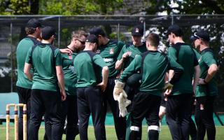 Cumbria County Cricket players celebrate Steven Croft's first wicket