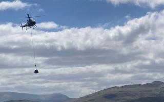 The Fix the Fells helicopter over the Lake District