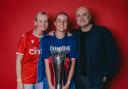 Aimee Everett with the trophy after Crystal Palace were promoted to the top