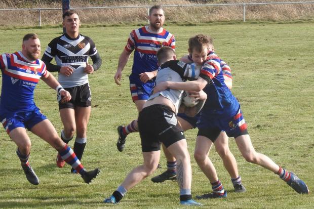 ON THE BACKFOOT: Matt Soldsby makes a tackle for Walney Central against Glasson Rangers   Picture: Leigh Ebdell