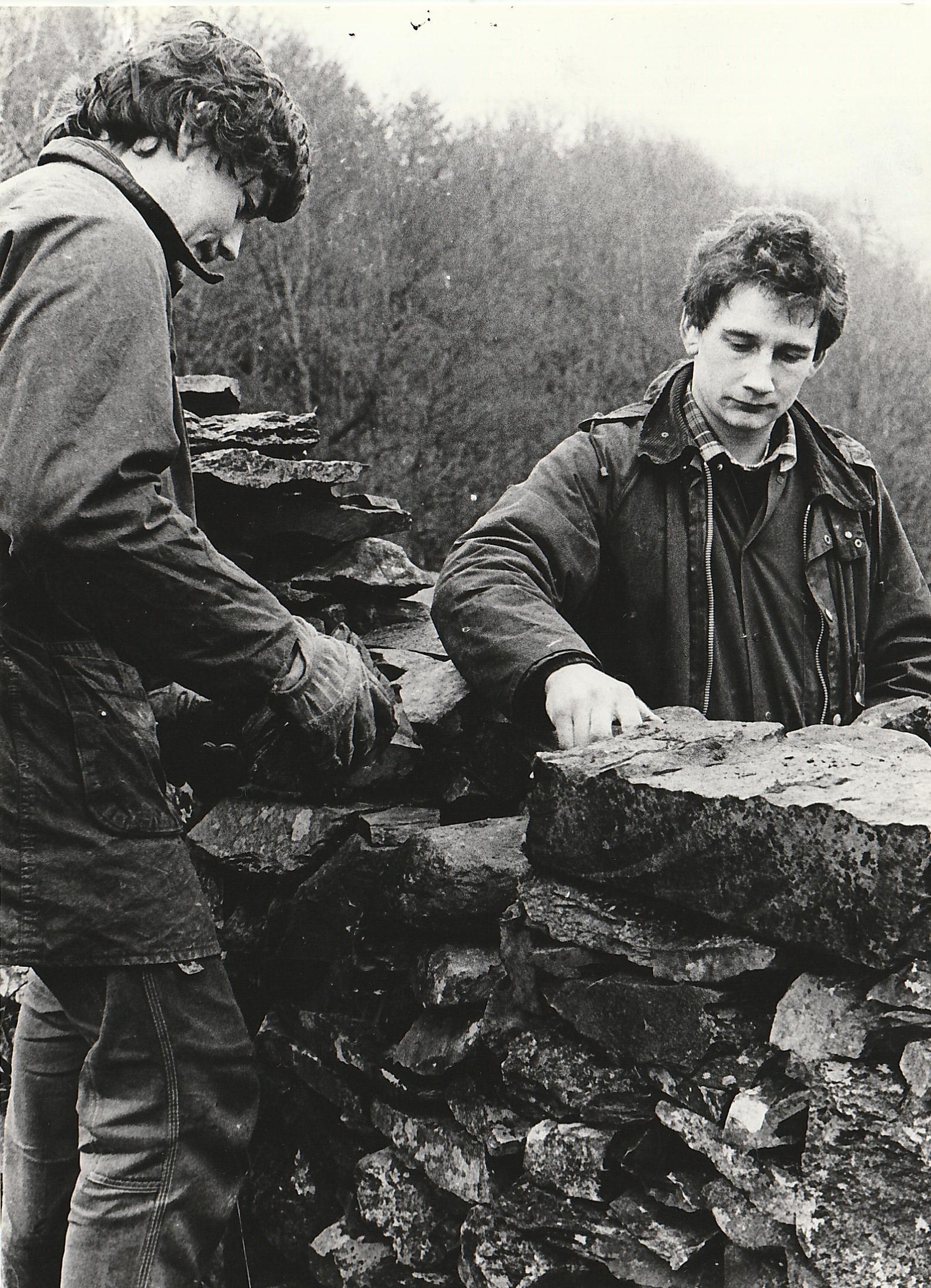 Walling work being carried out near Hawkshead in 1985 by National Trust woodmen David Woodburn (left) and Chris Taylforth