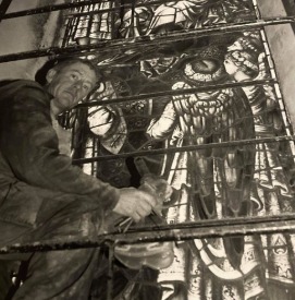 WORK: Jim Collins pictured carefully working on the windows of the church in 1997