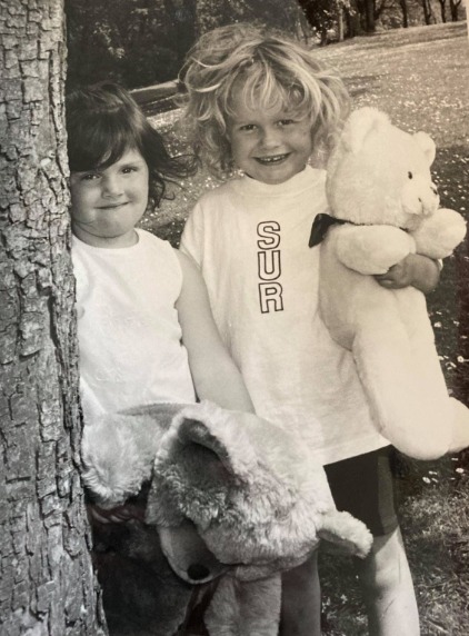 CUDDLES: Zoe Davey and Siobhan Dodd, both four, pictured at the picnic in 1995 with their teddy bears 
