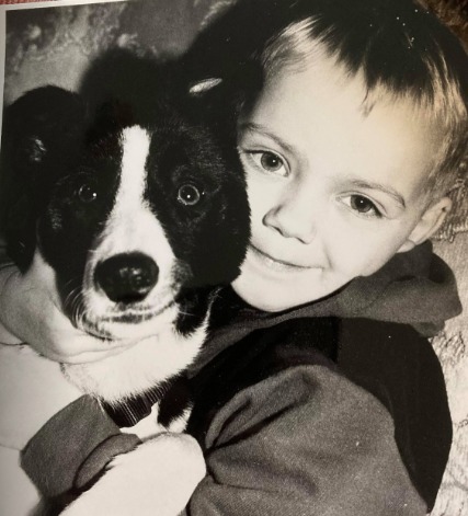 WELCOME: Four year old Steven Beck is reunited with Honey the missing border collie in 1997