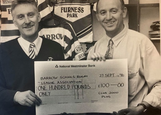 PRESENT: John Spoor presenting a cheque to Alan Craven of Barrow schools RL association in 1996