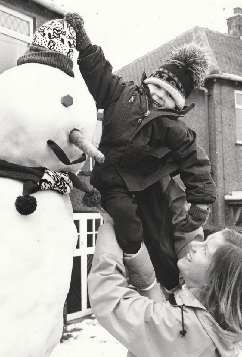 TOPPED OFF: Stephanie and Robert Blackburn, aged three, with their snowman Sammy in Barrow in February 1994