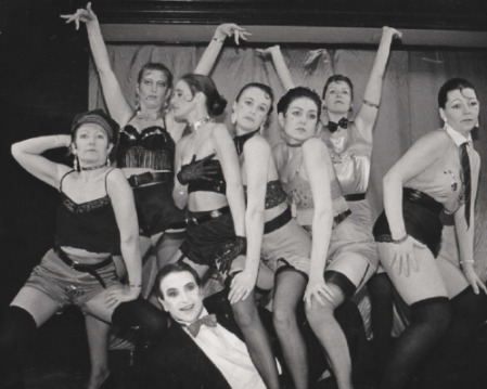 POSE: Tony Flanagan as the MC with the Kit Kat girls in Barrow Amateurs’ production of Cabaret in 1991