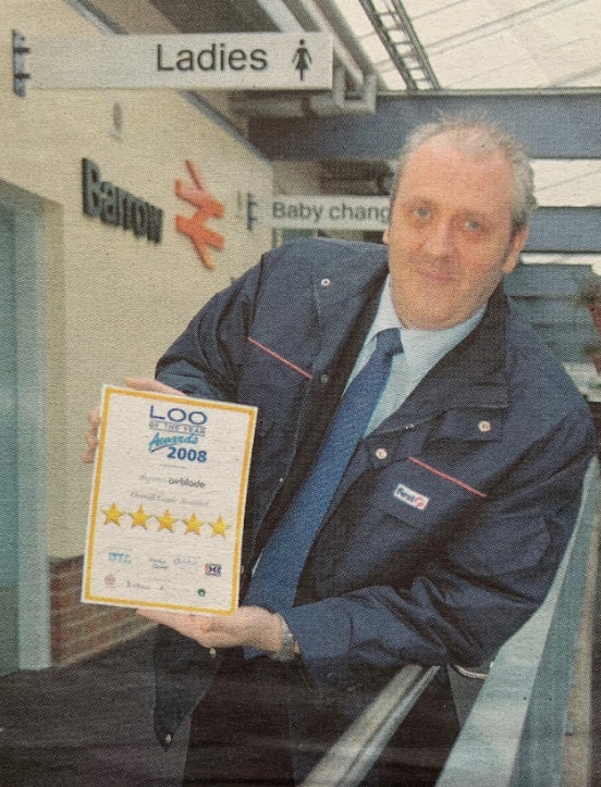 PRESENT: Barrow railway station manager Mick Elliott in 2008 with the certificate from the loo of the year awards