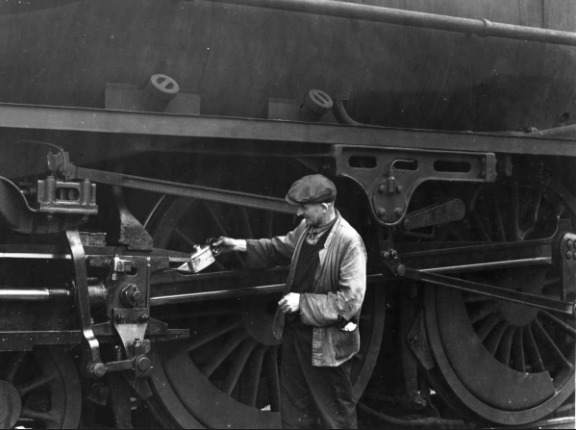 MAINTENANCE: A British Railways steam locomotive gets some oil at Barrow 