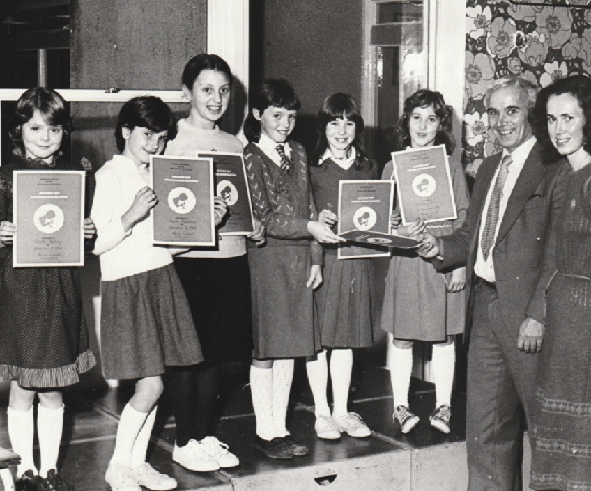 AWARD: Brian Blake, deputy director of education for Cumbria, presents Joanne Coles with her bronze certificate award when he attended Grange Primary School in 1984 to present six of the awards to pupils who had taken part in a nationwide scheme run by