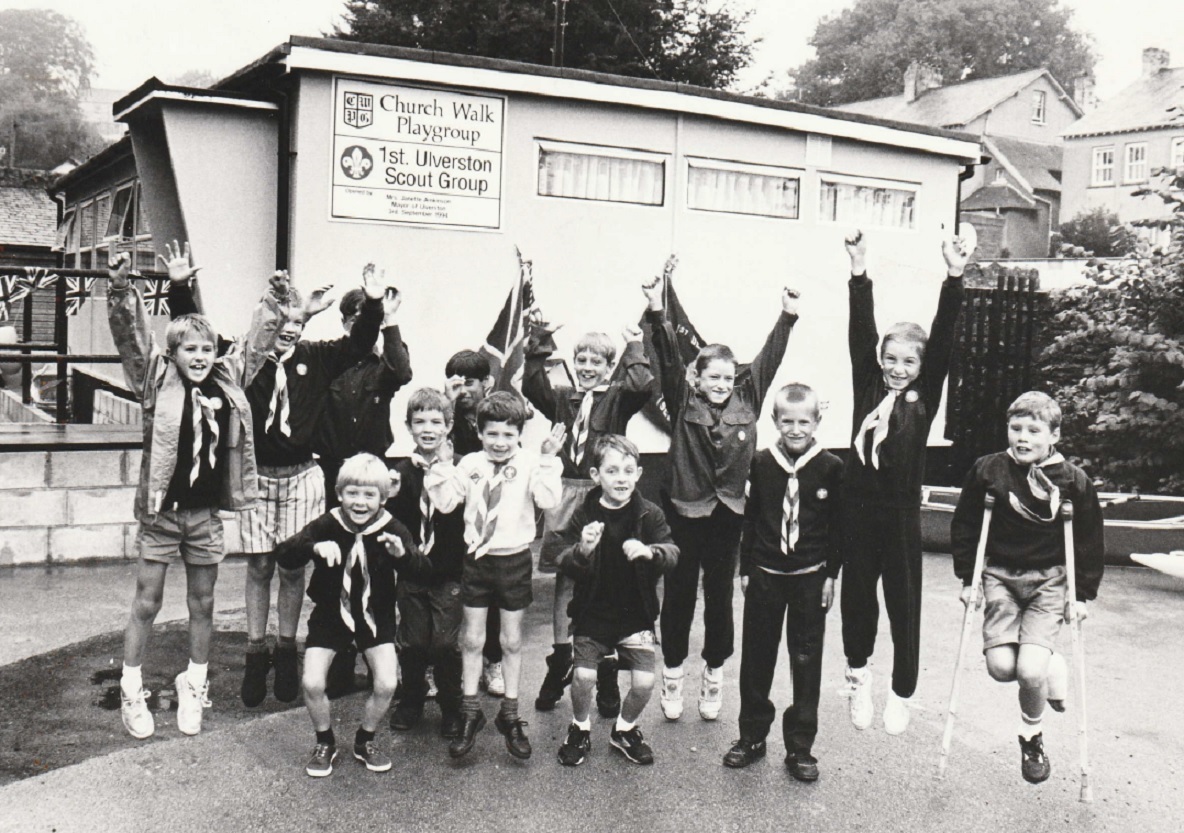 CHEER: Beavers, Cubs and Scouts from 1st Ulverston Scout Group celebrate getting their new headquarters in 1994. They were sharing them with Church Walk Playgroup