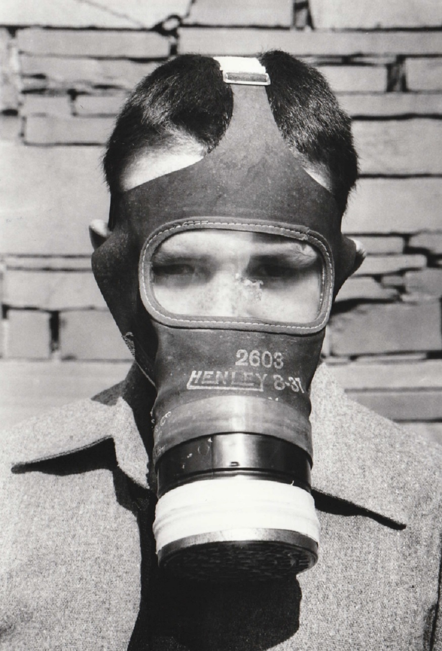 MASK: Coniston Primary School’s Ryan, ten, wearing a gas mask during a procession in Coniston Week in 1995