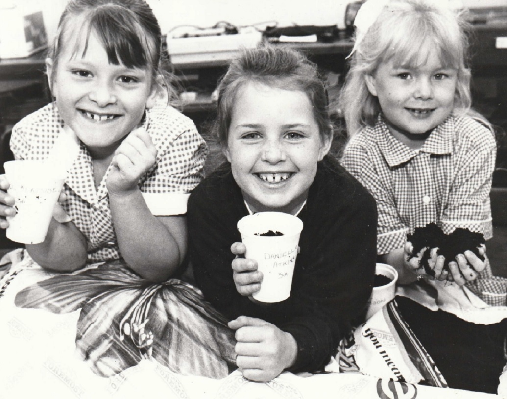 GROWTH INDUSTRY: South Walney Junior School children planted sunflower seeds as part of a competition to grow the tallest in 1997. Pictured are Alice Heavyside, Daniella Atkins and Grace Williamson