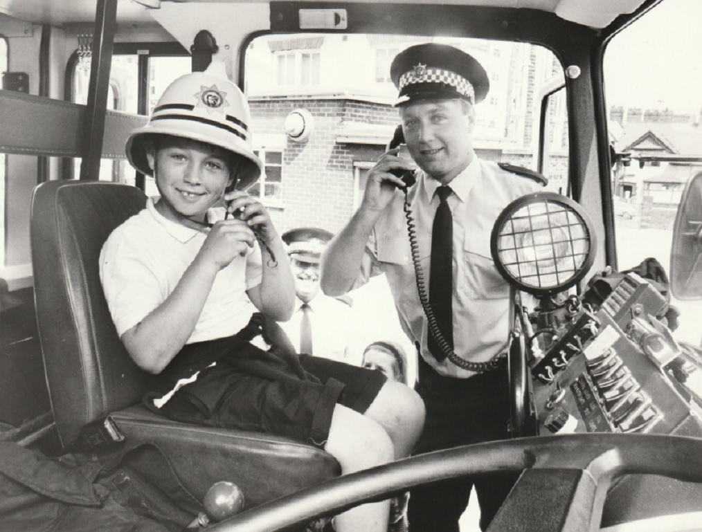 SCHOOL: Pupil John Burgess with firefighter Phil Hawthorne during a visit to the school by the Walney Brigade in 1992
