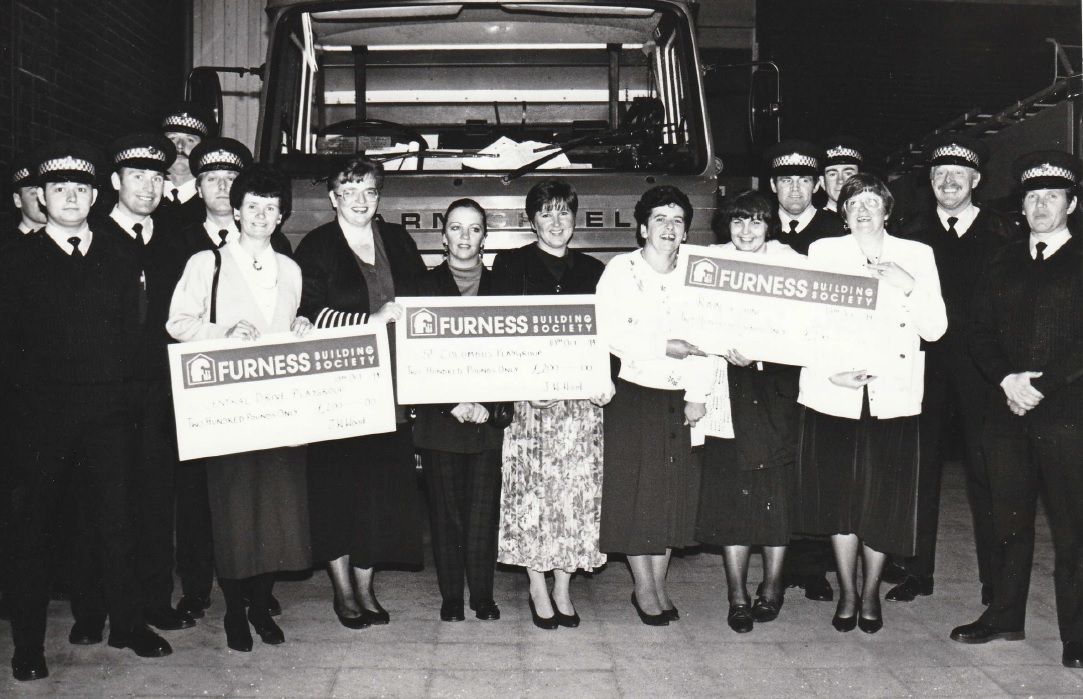 WALNEY: Walney Central St Columbus and Rain and Shine playgroups receive donations form Walney fire service in 1994 after a wheelie bin push