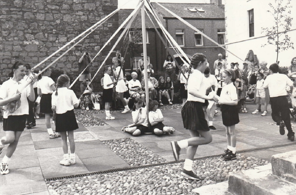 SCHOOL: Pupils of St Mary’s School, Dalton, perform a May Pole dance at the fair in 1997
