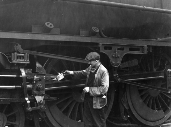 RAIL: A British Railways steam locomotive gets some oil at Barrow around 1950
