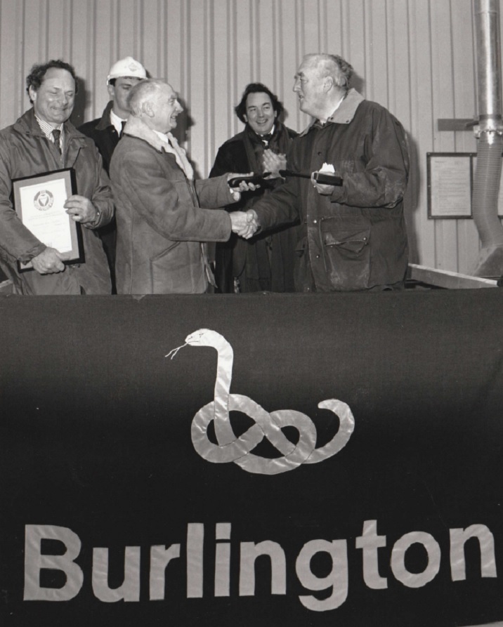PRESENTATION: Viscount Whitelaw presented the BS5750 Quality Assurance certificate to managing director David Wallace (far left) at Burlington Slate’s Kirkby-in-Furness quarry