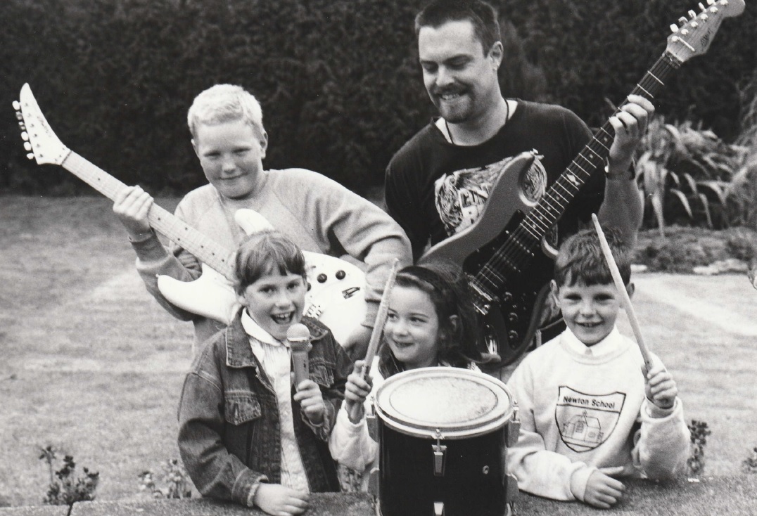 FUN: Pupils Matthew Hull, ten, Adele Robb, seven, Carrie Fisher, seven and Josh Slee, eight, with Clyde from Baby Insane in 1995. The band was due to play at a rock night to raise money for computers at the school
