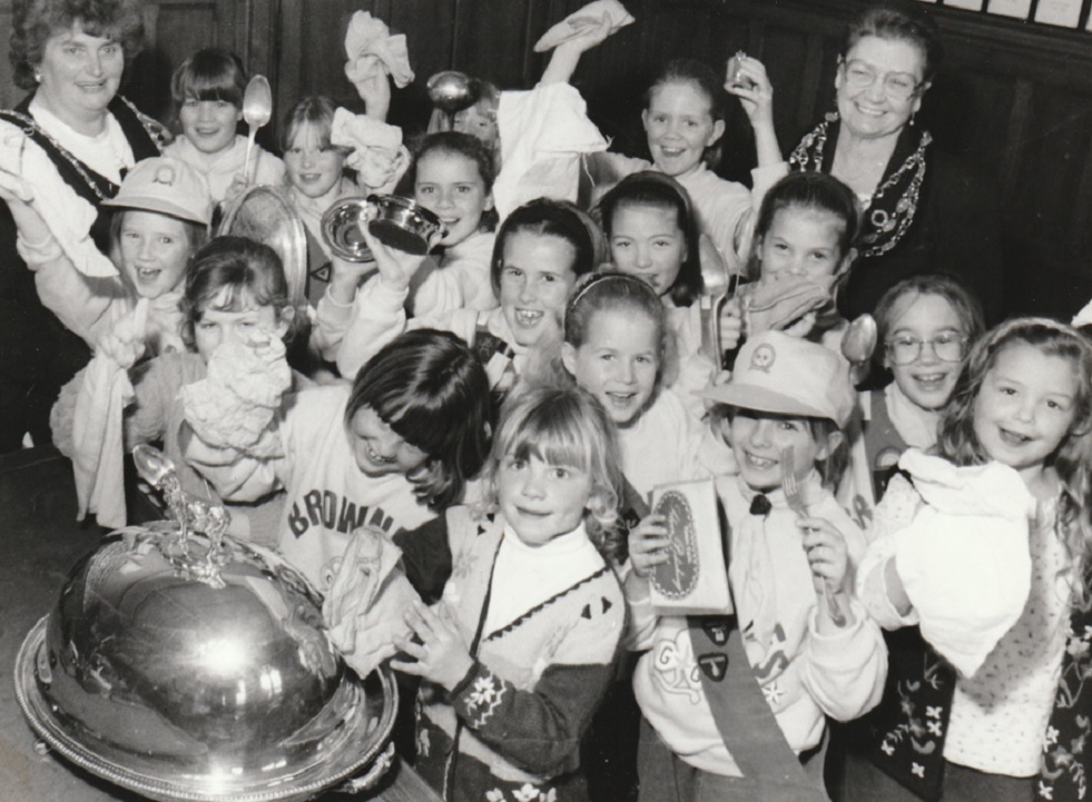 ULVERSTON: Members of the 25th Rampside Brownie pack polishing the mayor’s silver during a visit to Barrow Town Hall in 1996. Also pictured are the mayor and mayoress of Barrow, Cllr Flo Proudfoot (back right) and Cllr Jean Waiting