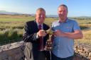 Dunnerholme captain Dave Howarth presents the Captain’s Trophy to David Tyson