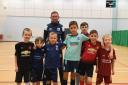 TIGHT-KNIT: Ben, Harris, Joel, Lewis Cjay and Callum with community coach Matty Taylor at Barrow AFC Community Trusts' final futsal session at Furness College